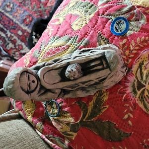 A sweet native American in sled with his dog.Great for Christmas scene.